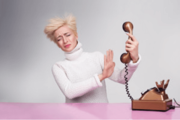woman dealing with verbal abuse over the phone